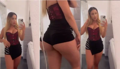 Bela Marquez se admirando no espelho, toda travessa