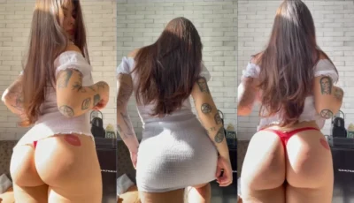 Deliciosa morena de vestido branco dançando e arrasando