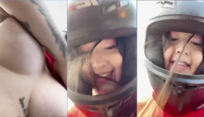 Valecasta mostrando os peitos enquanto pilota a moto